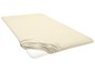 Un drap-housse beige pour matelas.