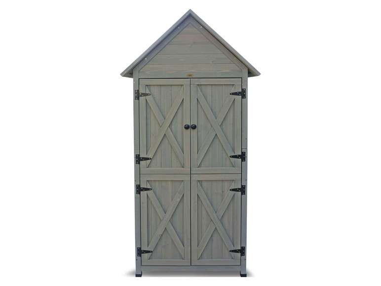 Un abri de jardin en bois gris avec des portes doubles.