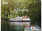 Une femme dort sur un matelas Hns dans un environnement vert.