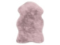 Tapis en fourrure rose en forme de mouton.