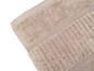 Une serviette de bain beige avec un motif côtelé.