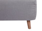 Un canapé gris en tissu avec des pieds en bois.