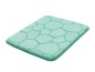 Un tapis de bain vert clair avec un motif en nid d'abeille.