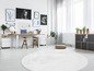 Un tapis rond blanc dans un salon moderne avec un bureau, des chaises et des plantes.