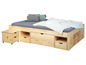 Un lit en bois avec rangement, y compris une table de chevet.