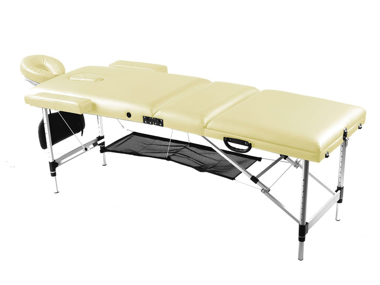 Une table de massage beige avec un cadre en métal et un filet de rangement.
