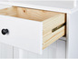 Armoire blanche avec un tiroir ouvert, un intérieur en bois visible et une poignée noire.