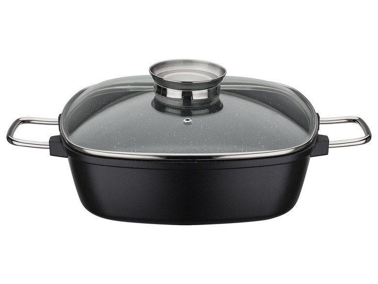 Une casserole noire avec un couvercle en verre.