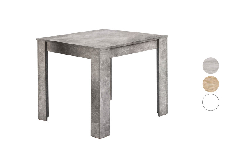 Table de salle à manger carrée avec un aspect béton.