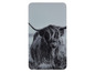 Un dessous de plat en verre avec une photo en noir et blanc d'une vache Highland.