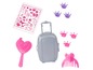 Une brosse à cheveux rose, une valise grise et des accessoires pour cheveux en forme de couronnes.