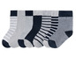 Sept paires de chaussettes grises et bleu foncé à rayures.