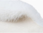 Tissu de fourrure blanc de près.