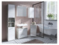 Salle de bain avec une baignoire autoportante, un lavabo et des armoires.