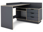 Bureau d'angle gris foncé avec trois tiroirs et des étagères ouvertes.