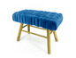 Un pouf bleu capitonné avec des pieds en bois.