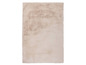 Tapis beige à texture douce.