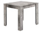 Une table carrée avec un aspect béton.