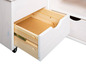 Une commode en bois blanc avec un tiroir ouvert.