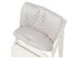 Housse de chaise Stokke Tripp Trapp grise matelassée avec un motif en losanges.