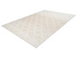 Tapis beige avec un motif géométrique blanc.