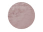 Tapis rond en peluche rose.