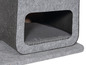 Une maison pour chat grise avec un coussin.