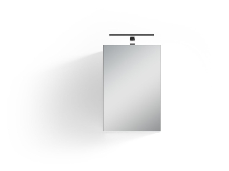 Un miroir de salle de bain avec un éclairage intégré.