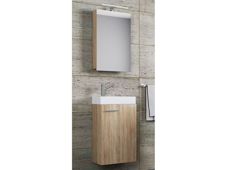 Un meuble de salle de bain avec un miroir et un lavabo