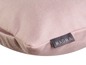 Un coussin rose avec une étiquette Magma.