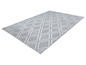 Un tapis gris avec un motif géométrique en losanges.