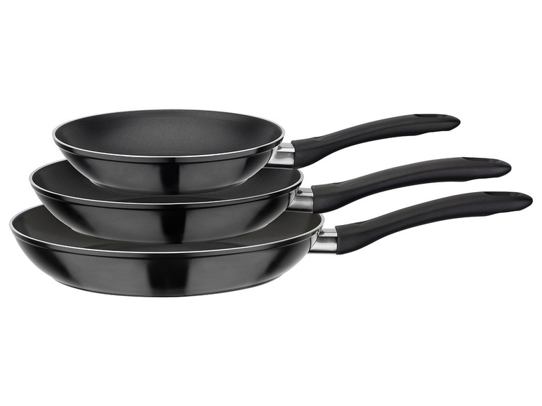 Un ensemble de trois poêles noires.