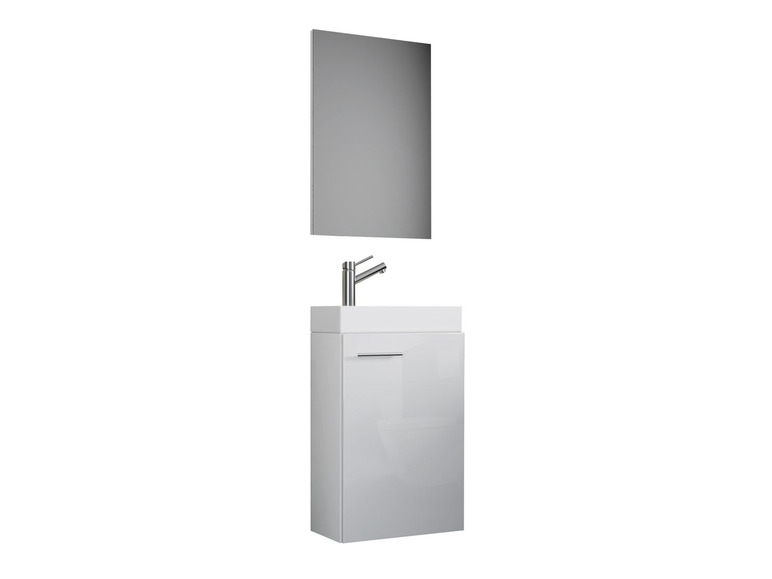 Un meuble de salle de bain blanc avec un lavabo et un miroir.