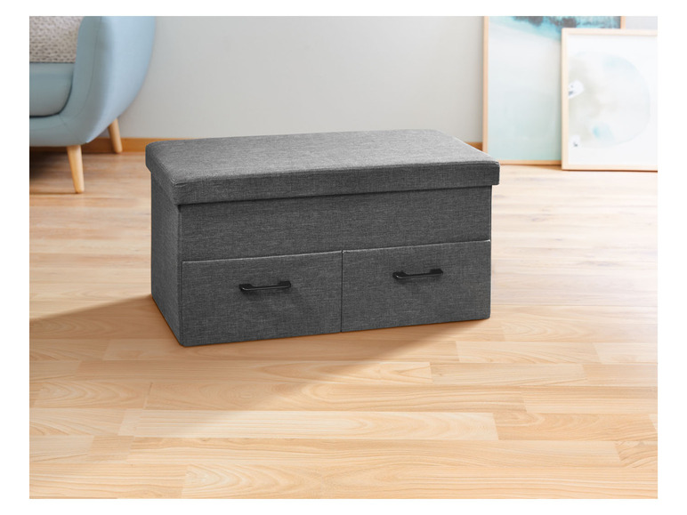 Un coffre de rangement gris avec deux tiroirs.