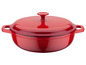 Une cocotte en fonte rouge avec un couvercle.