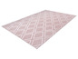 Un tapis rose avec un motif géométrique blanc.