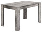 Une table à manger grise avec un aspect béton.