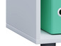 Commode blanche avec un classeur vert