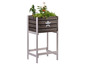 Jardinière en bois avec une étoile blanche et des plantes