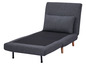Un canapé-lit gris déplié en chaise longue.