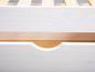 Commode en bois blanc avec deux tiroirs.