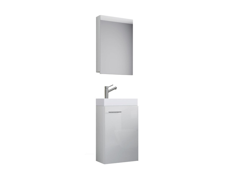 Un ensemble de salle de bain blanc avec une armoire miroir et un lavabo.