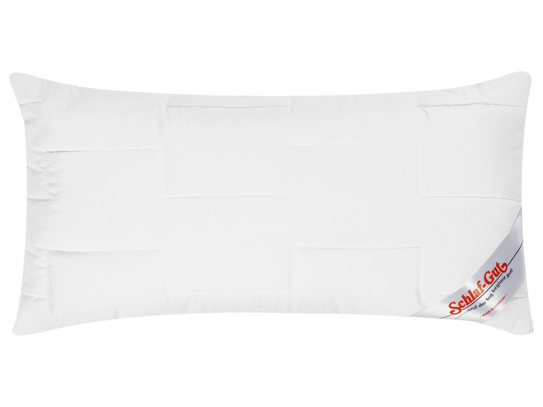 Oreiller blanc avec le logo 'Schlaf-Gut'.