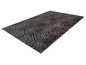 Un tapis gris foncé avec un motif géométrique.