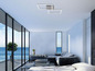 Une chambre à coucher moderne avec vue sur la mer et un luminaire de plafond rectangulaire.