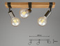 Trois lampes avec une barre en bois de style industriel.
