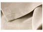 Serviettes en lin beige pliées.
