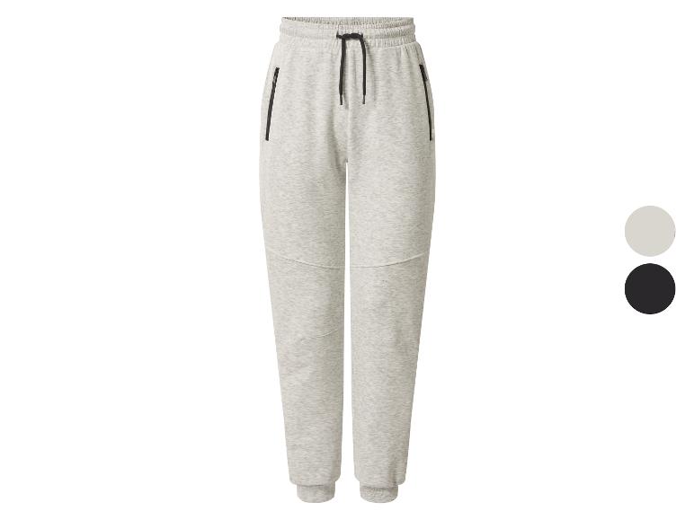 Pantalon de jogging gris avec poches zippées et cordon de serrage à la taille, avec des échantillons de couleur noire et claire.