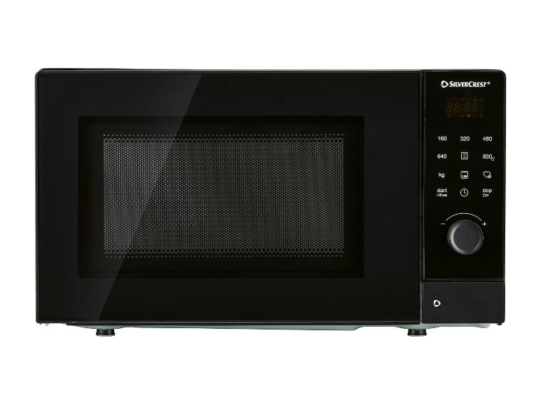 Micro-ondes noir avec affichage numérique et bouton rotatif.