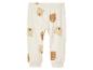 Pantalon beige à imprimé ours pour bébé.